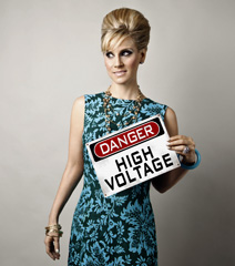 Dusty posing with High Voltage sign